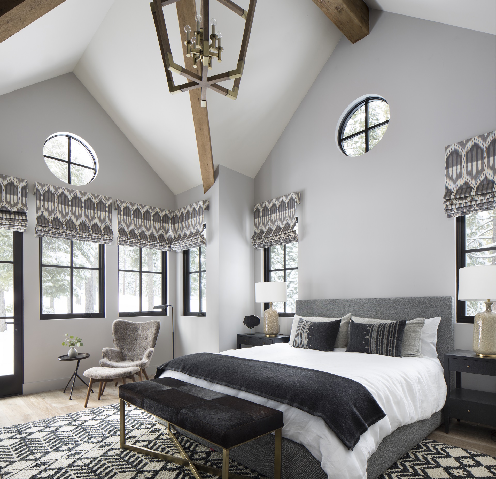 Shades of grey bedroom with roman shades