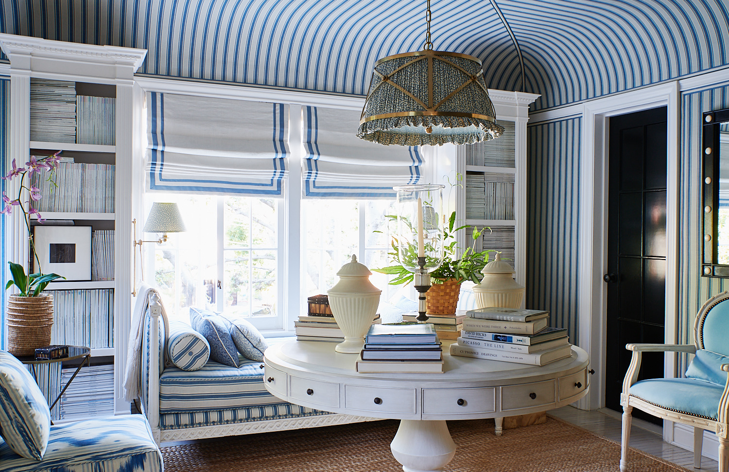 Upholstered ceiling, divan with matching bolster pillow and various throws